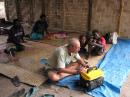 Mr. Fixit tries to breathe life back into the little generator: Banam Bay, Malekula Island, Vanuatu 2009